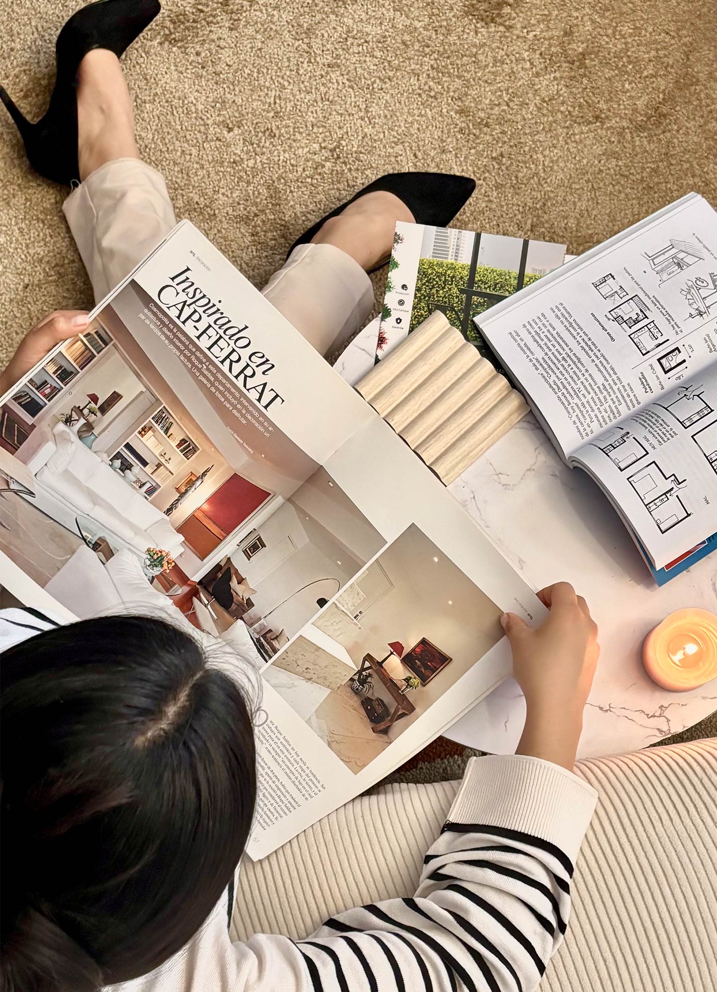 Women on the floor looking at magazines and branding like material